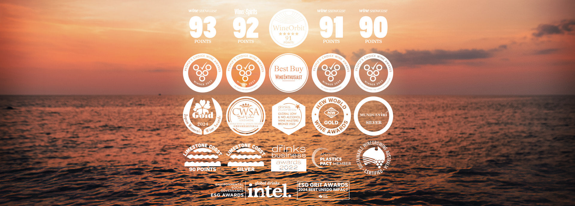 Overlay of wine award logos on an ocean sunset. Highlights include 93 pts from Wine Showcase, 92 pts from Wine & Spirits, 91 pts from Wine Orbit, multiple People's Choice Wine Awards (2023 & 2024), Wine Enthusiast Best Buy, and medals from Japan Women’s Wine Awards, CWSA, New World Wine Awards, and Mundus Vini. Also features sustainability badges from ANZPAC Plastics Pact, Sustainable Winegrowing Australia, Drinks Business Awards, and Intel ESG GRIT Awards.